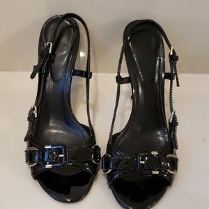 Burberry quilted buckled heels.